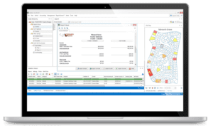 Laptop displaying HOA accounting software interface with financial reports and community map.