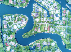 aerial view of community with water