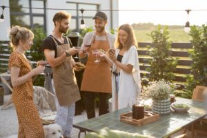people grilling in backyard
