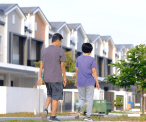 kids walking in front of houses